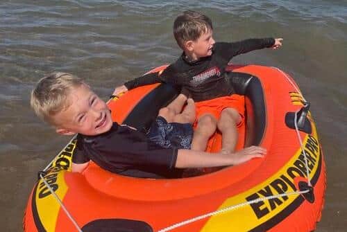 Nathan with friend Findlay in the inflatable that blew from the beach. (Photo: Laura Gallagher)
