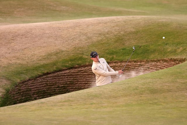 Matthew Fitzpatrick of England plays a shot from the bunker on the 17th during Day One of The 150th Open at St Andrews Old Course on July 14, 2022 in St Andrews, Scotland. (Photo by Warren Little/Getty Images)