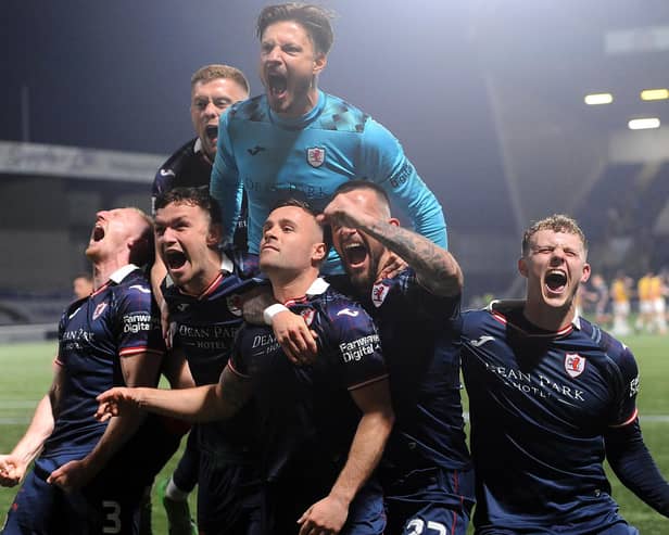Ecstatic Raith Rovers players mob Lewis Vaughan after the struiker's winning penalty against Partick Thistle (Pics Fife Photo Agency)