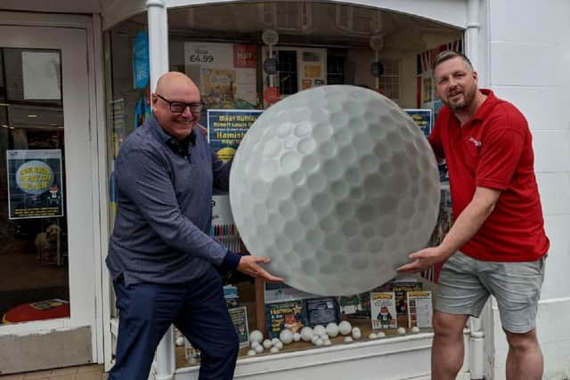 Richard East, store manager, and Robert Lewis Heron launch the competition.