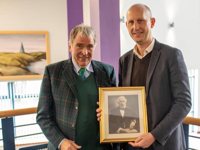 William Garner, George Lauder's great-great grandson, presented a framed photograph college principal Jim Metcalfe to mark the 125th anniversary (Pic: Fife College)