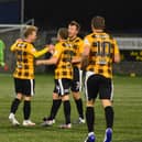East Fife's players are all smiles after hitting the net, and are hopeful they can take to the field again in March. Pic by Kenny Mackay