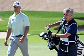 Calum Hill  and caddie Phil Morbey during the third round of the Saudi International. (Photo by Ross Kinnaird/Getty Images)