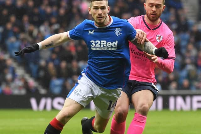 Rangers' Ryan Kent and Raith Rovers' Brad Spencer tussle for possession of the ball in midfield (Photo by Craig Foy/SNS Group)