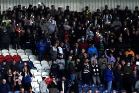 Raith supporters after the lights went out at Stark's Park on Friday night during the derby with Dunfermline (Pic: Fife Photo Agency)