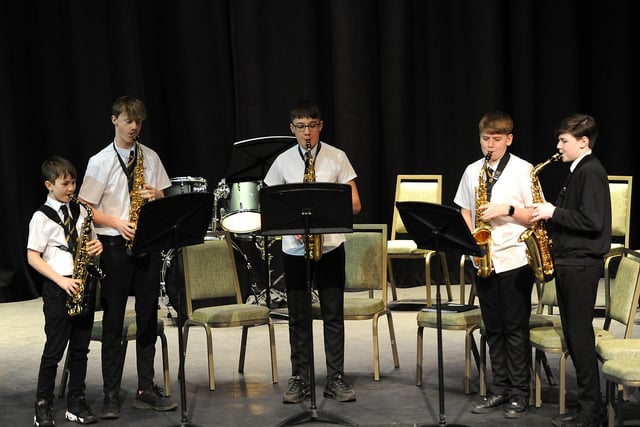 Kirkcaldy High School sax ensemble on stage.