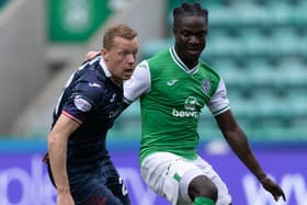 Brown battles with Hibs' Elie Youan (Pic Ross Parker/SNS Group)
