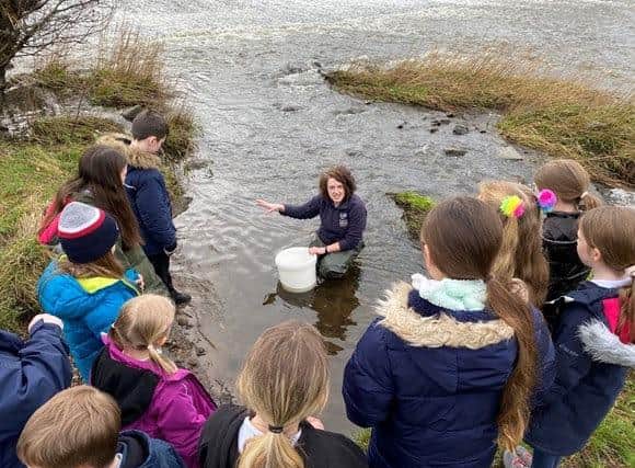 the P3/4/5 class from Coaltown of Wemyss Primary, along with Amy Fergusson, from the Forth Rivers Trust.