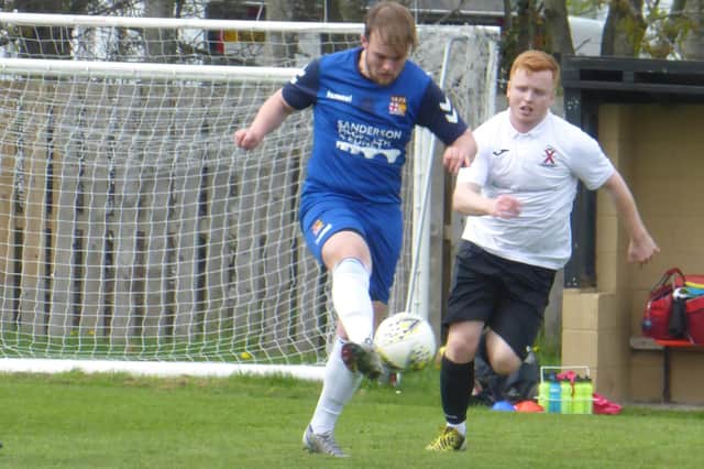 Fraser Anderson looks to win the ball back for Saints. Pic by Donald Gellatly