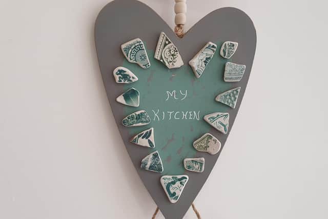 Loraine has made plaques featuring the pottery shards.