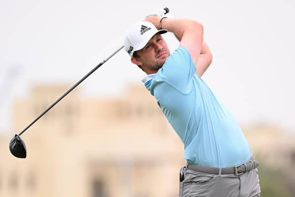 Connor Syme tees off on the second hole during day four of the Ras Al Khaimah Classic at Al Hamra Golf Club. Photo by Ross Kinnaird/Getty Images