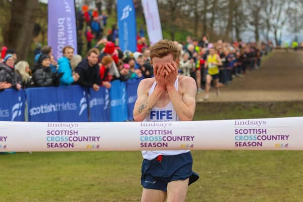 An emotional Logan Rees crosses the finish line first to win the senior men national cross country race at Falkirk (Pic by Scott Louden)