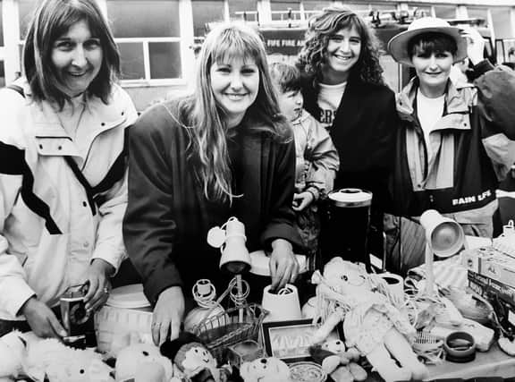 The 1993 summer fete staged by the Playgroup Association at Glenwood in Glenrothes. Pictured at the Thornton Toddler & Playgroup stall are Alison Willis, Jill Imrie, Rebecca Hyndman (aged 4) Rae Hyndman and Janette Carstairs.