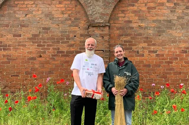 Duncan Mitchell with Fiona Young (Activities Co-ordinator) outside the flax mill in Silverburn Park.  Fiona is pictured with flax sown in the park as part of the initial heritage information programme.  (Pic: submitted)