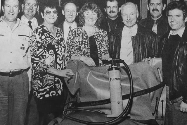 Regulars at the Path Tavern, Kirkcaldy, raised enough money to buy two inflatable body splints for the local ambulance service.
Pictured receiving them from Path proprietress Linda Hutchison (fifth from left) is casualty nurse Annette Mitchell (third left) and Fife ambulancemen Sandy Rattray (third from right) watched by other hospital colleagues.