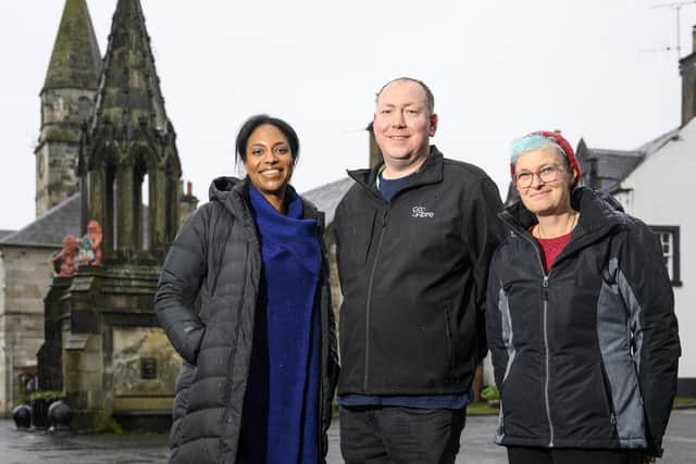Heids & Herts trustee’s Amber Smith (Left) and Jenni Gudgeon in front of the Bruce Fountain, Falkland with Go Fibre’s BAE Martin Cassidy (Pic: Ian Georgeson)