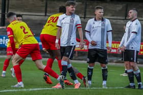 St Andrews United defenders look gutted as Albion Rovers’ Alex McCaw heads in the winning goal (Pics by Phil Dawson)​