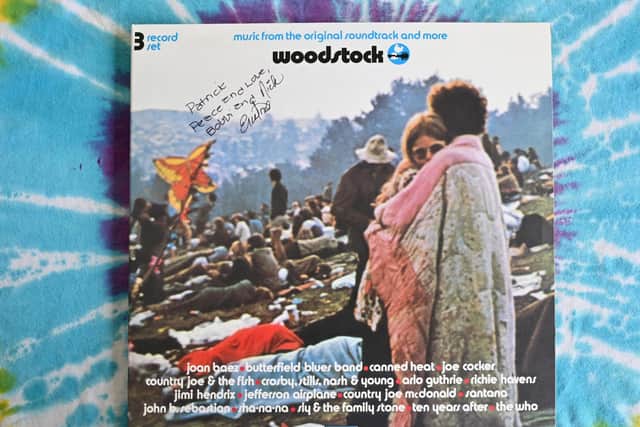 A live album of "Woodstock: Music from the Original Soundtrack and More" features couple Bobbi and Nick Ercoline on the cover (Pic:  Angela Weiss/AFP via Getty Images)
