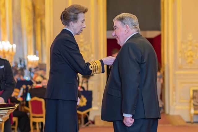 Iain Marnock receives his OBE from the Princess Royal