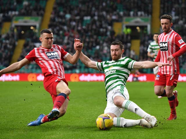Ross Matthews challenges Celtic's Anthony Ralston. (Pic: Mark Runnacles/Getty Images)