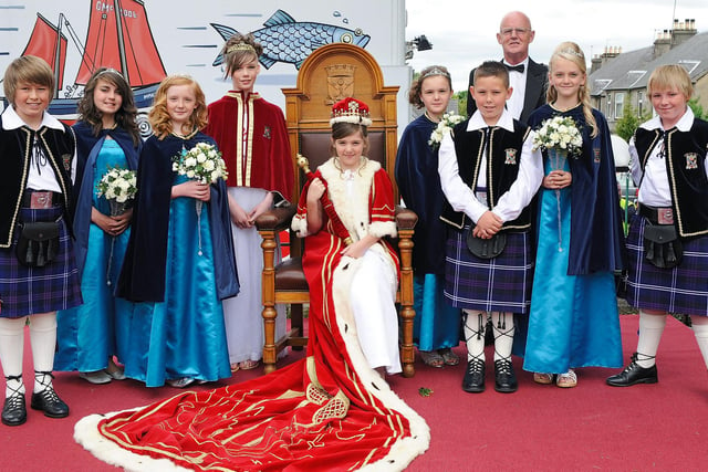 2010 2010 Leven Rose Queen Lauren Farquhar (seated) with the royal party and Mr George Robertson (rear) at the Leven Rose Queen ceremony, Leven