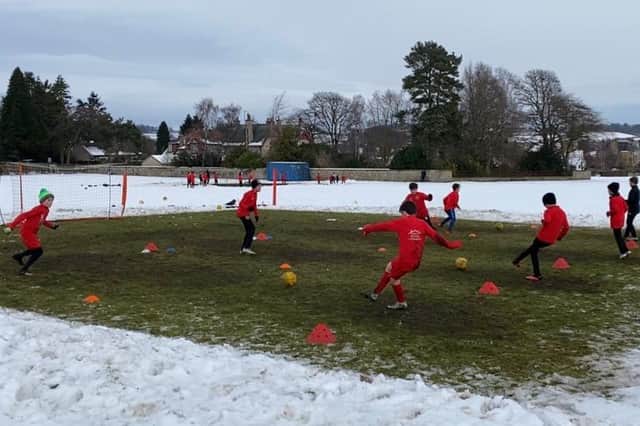 The local footballers are put through their paces at training despite both Covid-19 restriction and weather challenges.