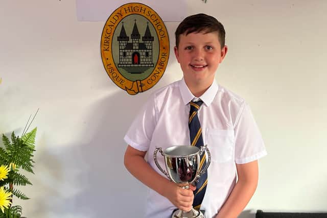Logan with his Gordon Aikman Charity Cup which was awarded to him from his school, Kirkcaldy High School.
