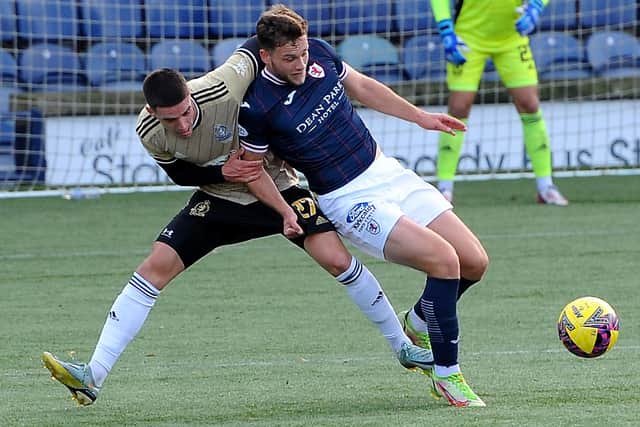 Jamie Gullan being fouled by Max Johnston, earning the free-kick that put Raith Rovers 2-0 up against Cove Rangers on Saturday (Pic: Fife Photo Agency)