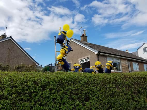 The Annand family's Minions scarecrows.