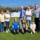 The cheque was presented by Norrie McArthur's wife Margaret, alongside his granddaughters and fundraisers. (Pic: Submitted)