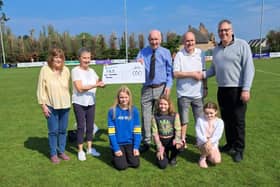The cheque was presented by Norrie McArthur's wife Margaret, alongside his granddaughters and fundraisers. (Pic: Submitted)