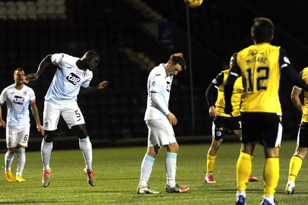 Fernandy Mendy clears in Rovers last outing against Queen of the South (Pic: Fife Photo Agency)