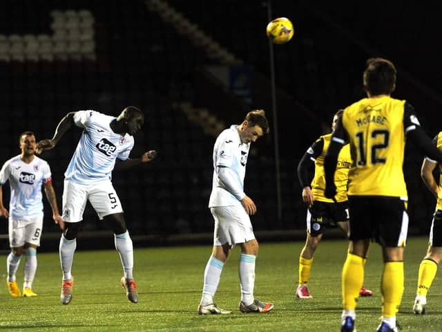 Fernandy Mendy clears in Rovers last outing against Queen of the South (Pic: Fife Photo Agency)
