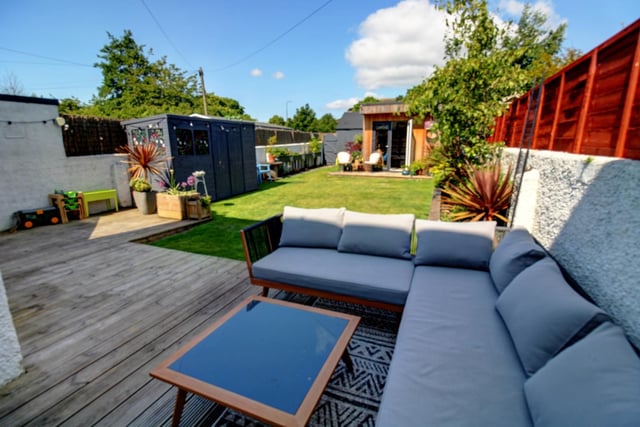 The garden area has deck and a summer house