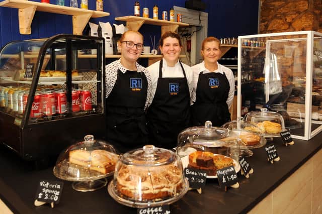 New owners of Roots and Seeds cafe bistro  - Corrie Robertson and Diana Marques , with staff member Luia (Pic: Fife Photo Agency)