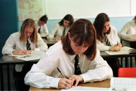 Secondary school pupils sitting an exam.