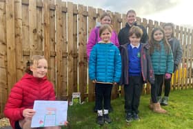 Greta is pictured with her winning design for the Hedgehog Highway alongside her classmates from Strathkinness Primary.  (Pic: Submitted)