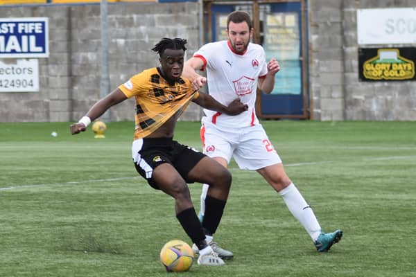 Andrew Osei-Bonsu comes in for some close attention. Pic by Kenny Mackay