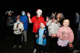 Lauren Sinclair (red T-shirt), founder of the Worldwide Santa's Christmas Eve Jingle Facebook page, took part in the event with family, friends and neighbours. Picture: Michael Gillen.
