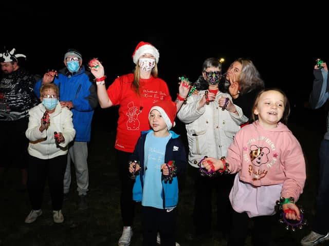 Lauren Sinclair (red T-shirt), founder of the Worldwide Santa's Christmas Eve Jingle Facebook page, took part in the event with family, friends and neighbours. Picture: Michael Gillen.