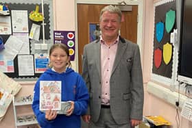 David Torrance MSP with winner of his annual Christmas card design competition, Abbie Callaghan, a pupil at Capshard Primary.