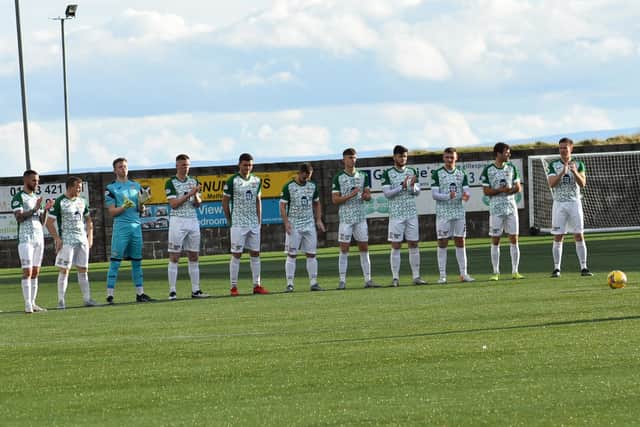 East Fife's players gathered pre-match to remember former director Ken Henderson and Rangers and Scotland boss Walter Smith who both passed away recently. All pictures by Kenny Mackay