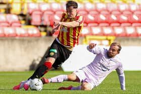 Partick Thistle defender Ben McPherson being challenged by Paul McMullan during a 0-0 draw for Raith Rovers at Glasgow’s Firhill Stadium on Saturday (Photo: Roddy Scott/SNS Group)
