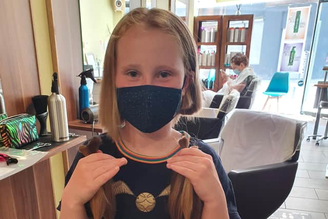 Holly (10) with her freshly chopped locks which she is sending to the Little Princess Trust.