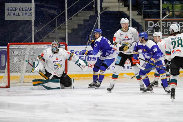 Greg Chase and Michael McNicholas in action for Fife Flyers against Belfast Giants (Pic: Jillian McFarlane)