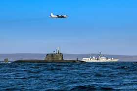 An Astute class nuclear submarine in company with the Type 23 frigate HMS Kent being over flown by a German Navy P3 maritime patrol aircraft (Pic: Royal Navy)