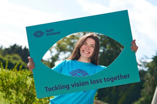 Kirsty Smith, senior fundraiser, showing off new Sight Scotland branding.