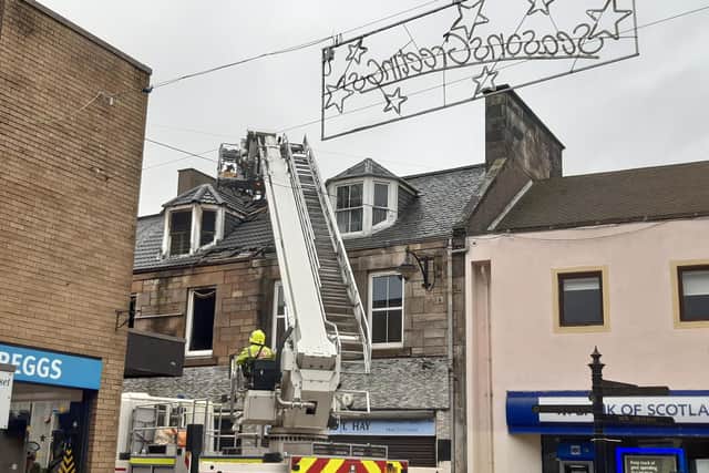 Fire crews at the scene of the fire on Leven High Street which remains cordoned off.