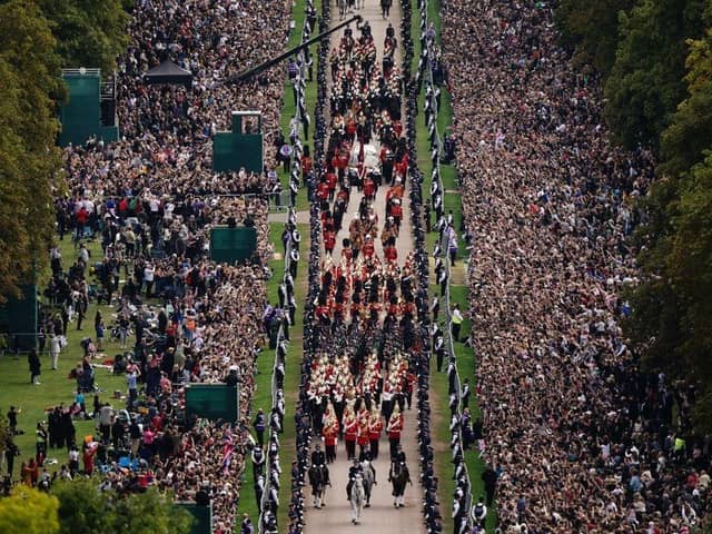 The State Hearse carrying the coffin of Queen Elizabeth II up the Long Walk