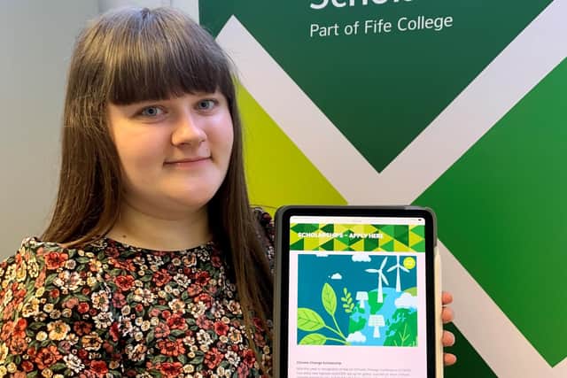 Caitlin Bryce from the scholarships team at Fife College showing the application page for the new scholarship.